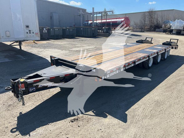 Trailer showing dual-axle car hauler with wood deck and front tongue; branding and decals visible on frame.