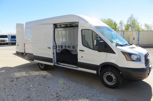 Ford Transit cargo van with side cargo door open showing empty interior and white body, black bumper and wheels.