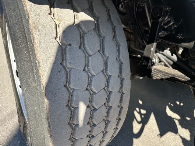 Truck tire tread close-up on Sterling L7500 cab or chassis showing worn tread pattern.