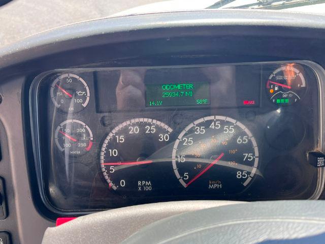 Dashboard of 2018 Freightliner M2 106 showing digital odometer readout and analog gauges including mph and tachometer with indicators.