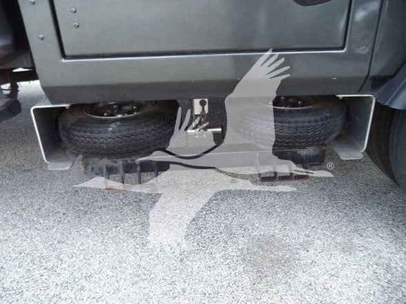 Ford F-450 dual rear wheels with spare tires visible under rear, stock number T11463FM not visible in image.