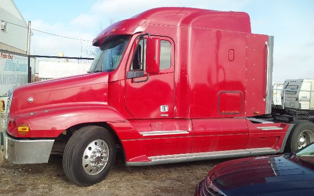 Freightliner conventional sleeper truck in red with aerodynamic hood and extended cab, side profile view.