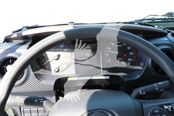 Dashboard and steering wheel of a 2025 Hino L6 cab and chassis showing instrument cluster and steering column.