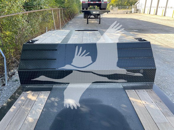 XL Specialized Mini Deck trailer rear view showing black diamond-plate fenders and wooden deck with two ramps extended.
