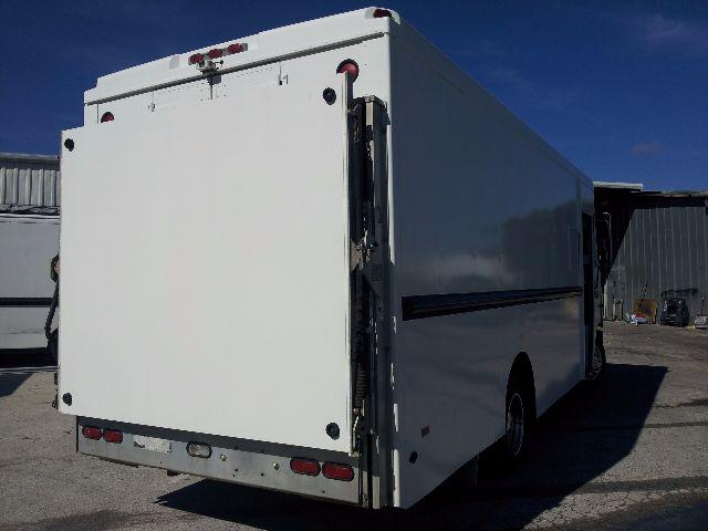 Box truck rear and side view showing white cargo box on Workhorse P42 chassis, with rear doors closed and steps visible.