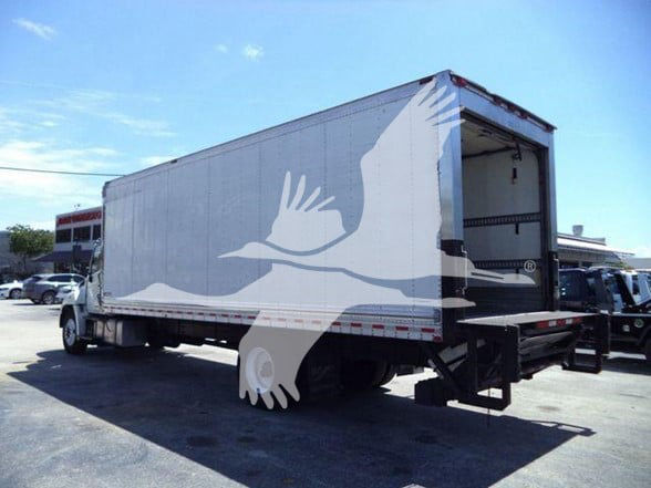 Truck trailer with open rear and reefer box. Visible text includes stock number 26196RFM and general category information. The image shows a 2019 268A, used reefer truck.