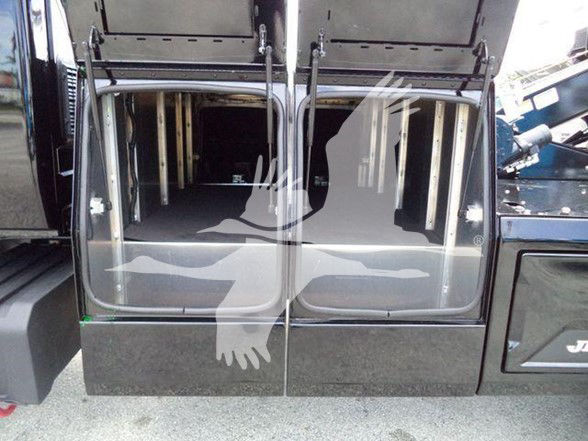 Truck cab entry doors open showing interior steps and cabin; faint watermark across image.