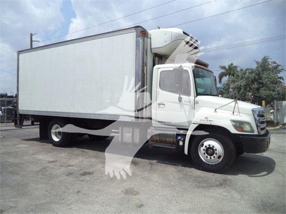 Box truck with a large refrigerated box on a white cab, front view angled, no visible text readable on body.