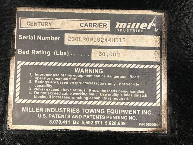 Label on Freightliner/Miller Industries towing equipment showing Serial Number 28OL20W1824HD15 and Bed Rating 30,000 lbs with warnings.