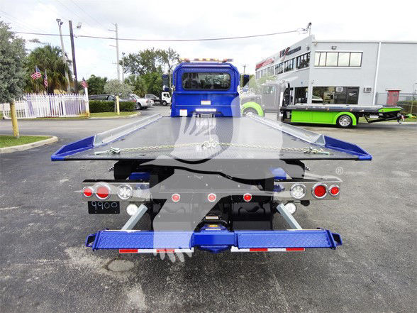 Peterbilt 337 tow truck chassis rear view with flatbed in blue, license plate area, lights, and bumper.