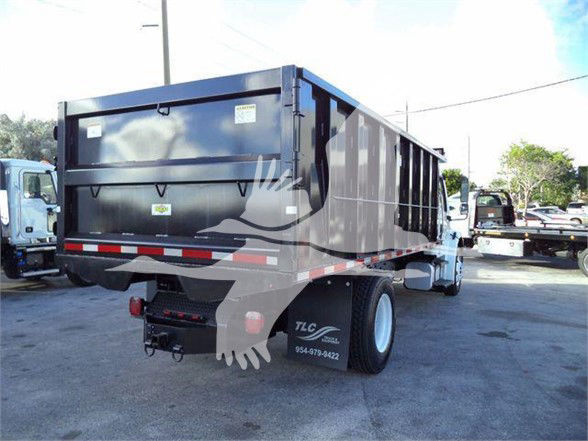 Freightliner truck rear and side dump bed showing VIN 1FVACWDT2CHBW0266 and stock number 268018R.