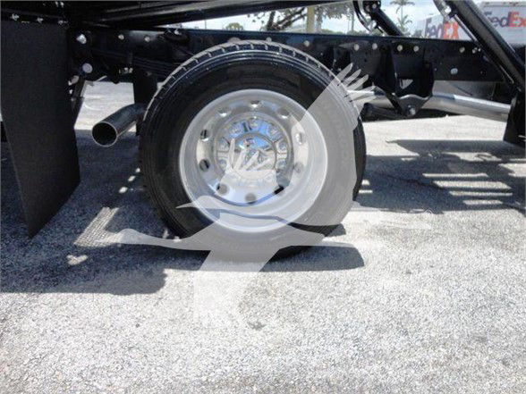 Ram 5500 wheel and chassis components shown in a truck bed area.