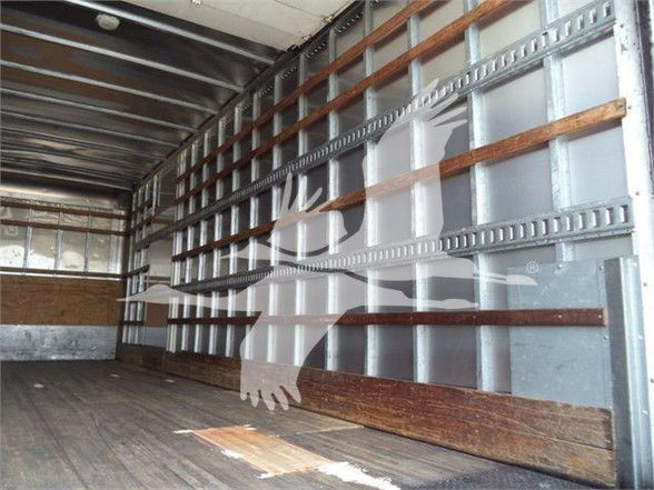 Truck bed interior with metal walls and wooden side rails; no visible branding or text on the interior.