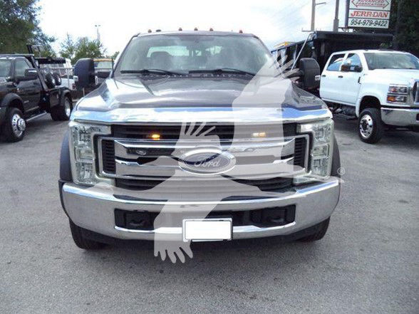 Front view of a 2017 Ford F-450 pickup truck in a dealership lot, chrome grille, Ford emblem, dual headlights, front bumper; watermark across image.