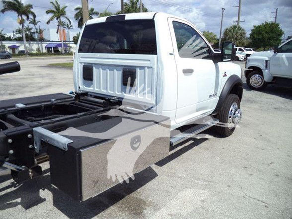 2024 Ram 5500 SLT chassis cab with utility box on side, wheel, and extended cab visible.