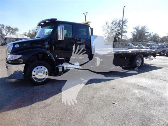 Tow truck with black cab and white flatbed, large bird watermark across center, no legible labels visible on vehicle.