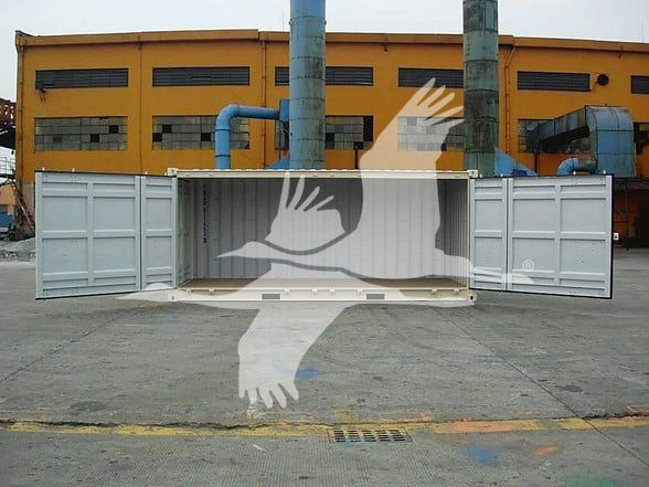 Container trailer with open doors in front of an industrial building. Visible are the container walls and floor, with a ghosting watermark across the center.