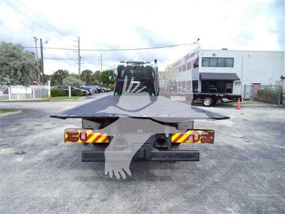 Tow truck flatbed rear view with license plate area and warning lights.