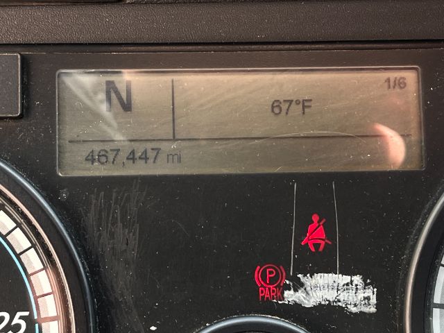 Dashboard display of a 2019 Freightliner Cascadia showing N gear, 67°F, odometer 467,447 miles, with parked indicator and seatbelt icon.