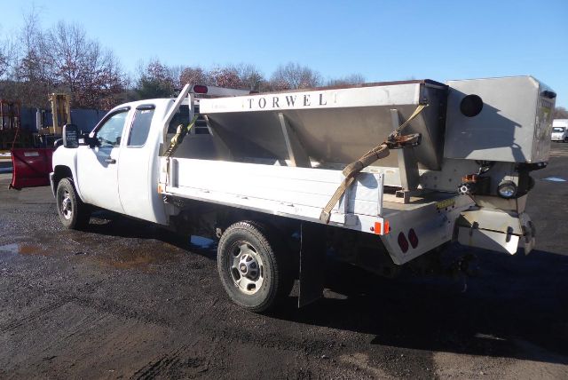 White Chevrolet 2500HD utility dump truck with Torwelt brand dump bed, side rails, and rear tailgate; VIN 1GC2KVCG7BZ142496 not visible; stock number 1221223 not visible.