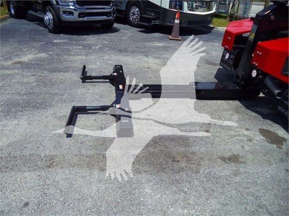 Tow hitch assembly on pavement with Ram 4500 SLT listing; metal frame with hooks and mounting points.