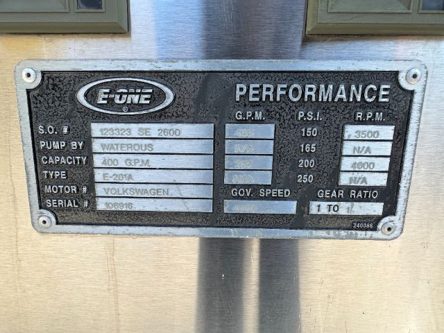 Plaque on equipment showing E-ONE Performance with serial numbers and specs: S.O. # 123323 SE 2600, Pump by Waterous, Capacity 400 GPM, Type E-201R, Motor # Volkswagen, Serial # 106916, G.P.M. 150-250, P.S.I. 165, 200, 4000 R.P.M. GOV. SPEE