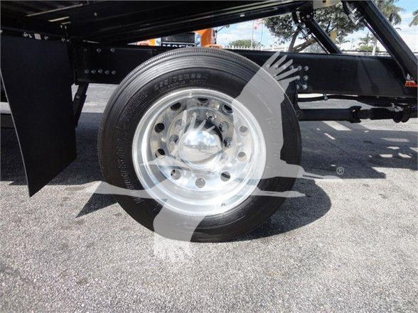 Mack MD6 chassis shows a single rear wheel with polished steel rim and black tire, undercarriage frame and components visible.