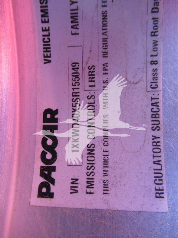 Vehicle label showing VIN and stock number from Pacar/Packar label with a purple background.