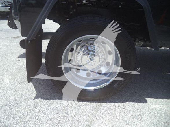 Wheel and tire of a Ram truck with a translucent overlay logo; no legible labels or serials visible on the image.