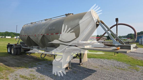 Fruehauf cement tanker trailer in side view showing cylindrical tank on dual-axle chassis with unloading piping and support legs.