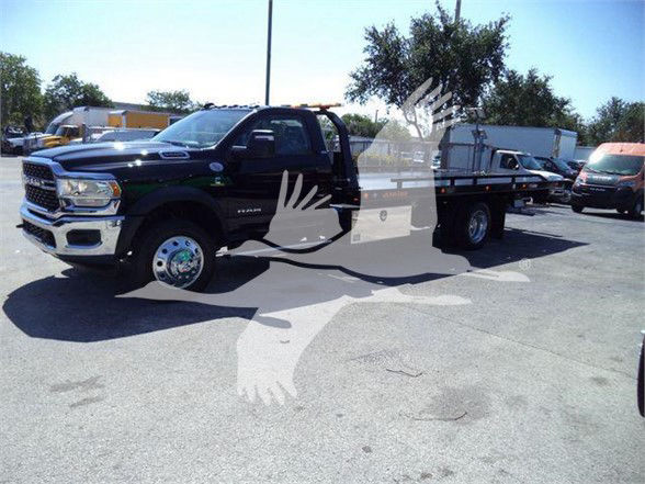 2024 Ram 5500 SLT white text on truck showing VIN 3C7WRMDL1RG164798 and stock number J64798. Tow category, new pickup truck.
