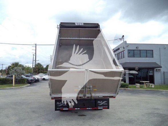 Dump truck bed with hydraulic dumping mechanism and rear view showing tailgate. Chevrolet W4500, stock and VIN not visible on image.