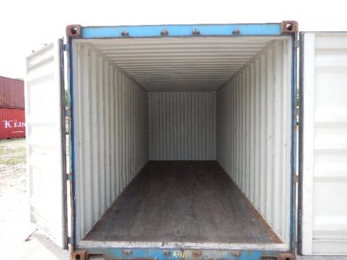 Open 20' dry container with empty interior showing corrugated metal walls and wooden floor.