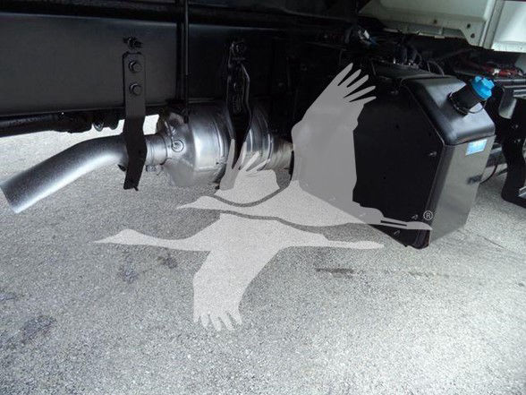Underbody view of 2019 International DURASTAR 4300 showing exhaust, drivetrain, and a black component. Visible text includes VIN and stock details in listing.