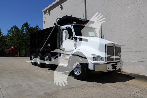 Kenworth T880 dump truck in white exterior with black dump bed, side view showing chrome bumper, grille, and dual rear axles.