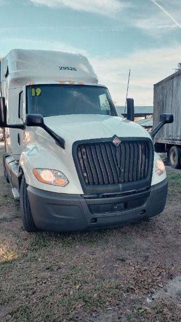 Truck front view showing International logo on grille, number 29526 on the cab, and the number 19 on the windshield.