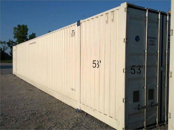 Container trailer showing 53' long CIMC single-use domestic container with doors at rear.