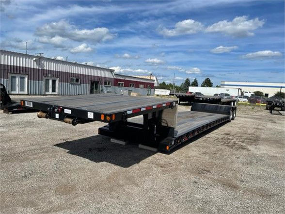 Fontaine Renegade 18 LX40 double drop deck trailer in an outdoor lot showing flatbed with low pro file and rear ramps.