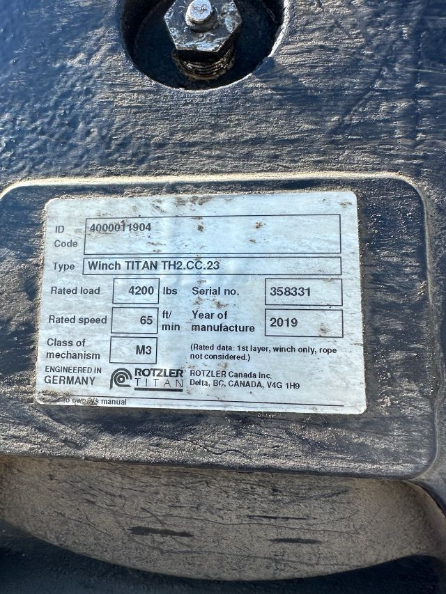 Identification plate on a Titan winch showing ID code 4000011904, Type Winch TITAN TH2.CC.23, Rated load 4200 lbs, Serial no. 358331, Rated speed 65 ft/min, Year 2019, Class M3, Rotzler Titan engineered in Germany.