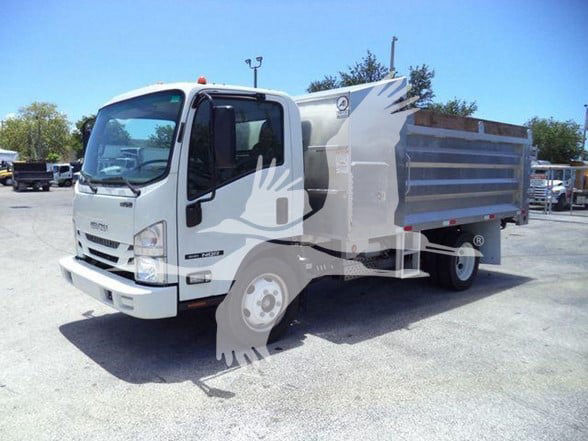 Isuzu NQR dump truck in a used lot with white cab and gray dump bed, stock number T02679FM