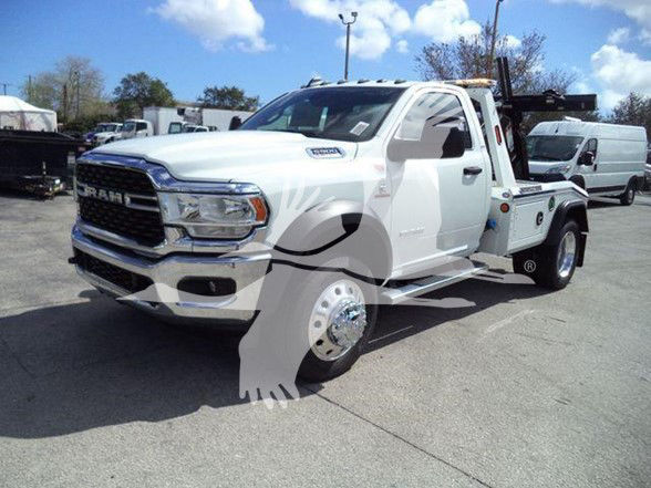 Tow truck showing 2024 Ram 5500 SLT front-left view with RAM grille, headlamps, dual rear wheel, service bed and crane.