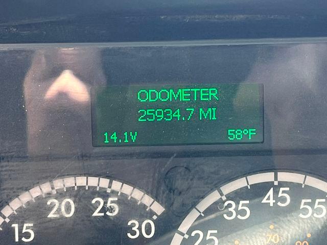 Dashboard display showing ODOMETER 25934.7 MI with 14.1V and 58°F, and partially visible speedometer gauges.