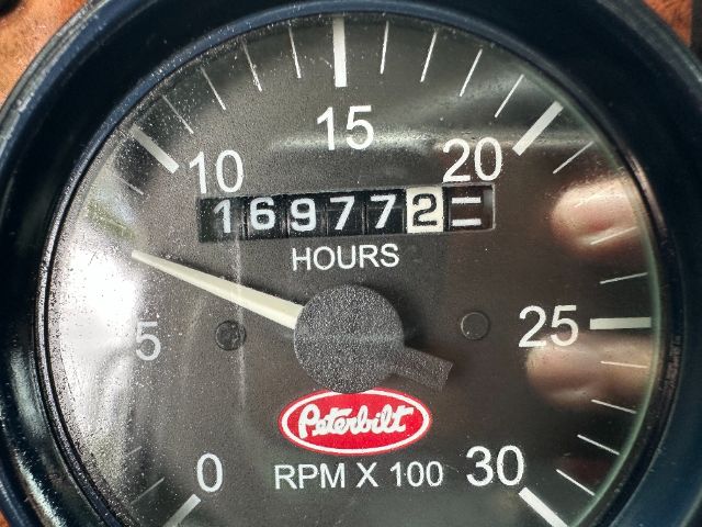 Peterbilt tachometer and hour meter showing 16972 hours, gauge labeled RPM X100, Peterbilt logo.