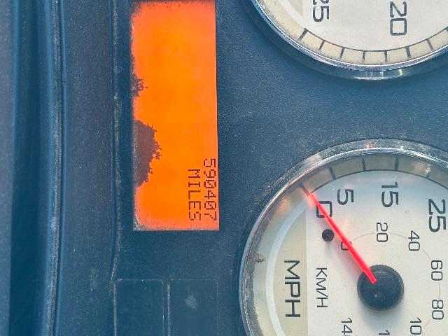 Dashboard gauges from a 2017 International Prostar showing speedometer MPH and fuel/engine indicators with orange maintenance sticker.