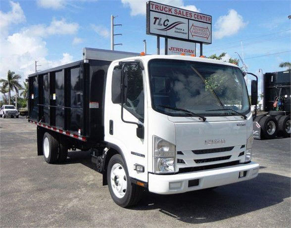 Isuzu NPR HD dump truck in white cab with black dump bed, front view, stock number J03502.