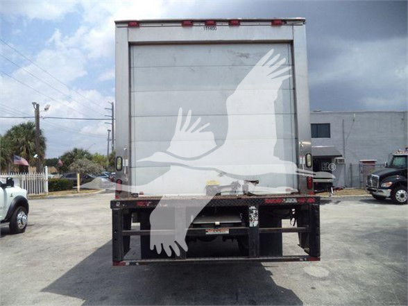 Truck trailer rear view showing closed reefer box with vertical door and black underrun guard.