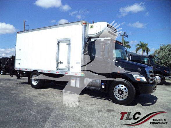 Truck with a white refrigerated box on a black cab, side view, with TLC Truck & Equipment logo.