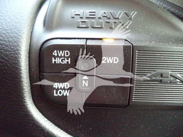 Ram 4x4 transfer case selector showing 4WD High, 4WD Low, 2WD, and 4WD Low labels around a circular selector with N in the center.