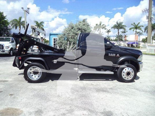 2018 Ram 4500 SLT tow truck with flatbed silhouette, side view showing cab and wheel, no visible text legible on the truck.