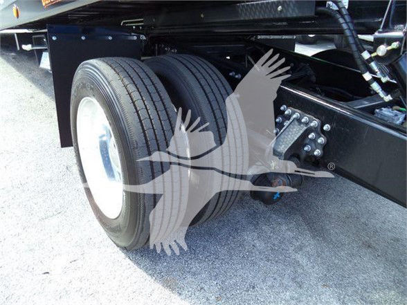 Mack MD6 chassis showing dual rear wheels and suspension components with visible frame and tire tread.